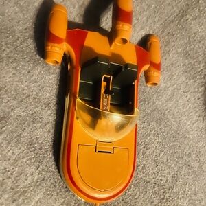 Orange and Red Toy Spaceship
